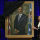 Attorney General Eric Holder (right) and his wife, Dr. Sharon Malone, help artist Simmie Knox (left) unveil Holder’s official portrait during a ceremony at the Justice Department Feb. 27, 2015, in Washington, D.C.
Mark Wilson/Getty Images